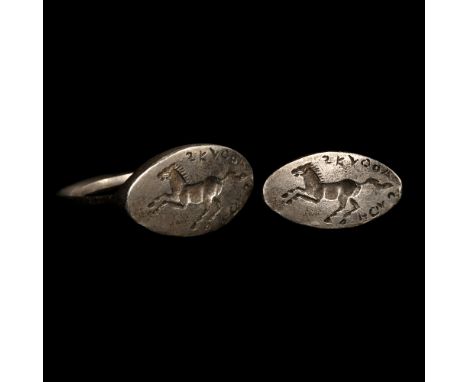 Circa 5th century B.C. Ellipsoid bezel with incuse figure of a running horse, Greek text 'ΣΚΥΘΟΑΓΑΘΗ' for 'the sake of Skytho