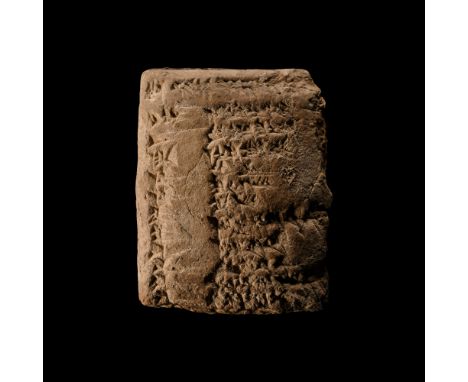 Early 2nd millennium B.C. Pillow-shaped with cuneiform text to the upper face; underside partly lost.  122 grams, 68 mm (2 5/