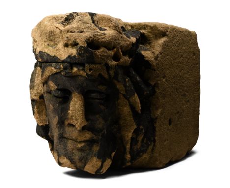 Circa 14th-15th century A.D. Rectangular corbel with head of Christ modelled in the half-round, turned slightly with the eyel