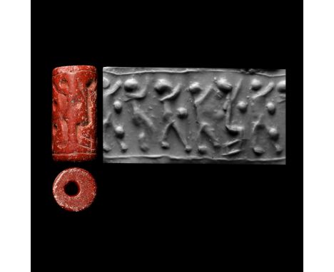 Circa 1200-900 B.C. Cylinder with cord and bead handles; accompanied by a copy of an old scholarly note, typed and signed by 