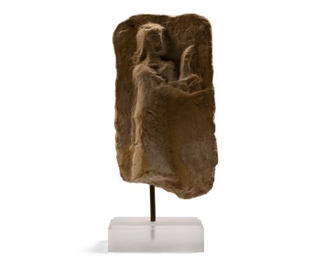 Levant, circa 1900-1600 B.C. Plano-convex in section with moulded offering scene depicting a man advancing to his left whilst