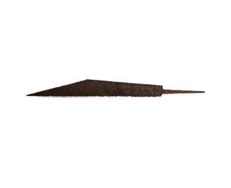 8th-10th century A.D. With scooped forward edge, straight single edge and arched triangular back; transverse mounting tang. C