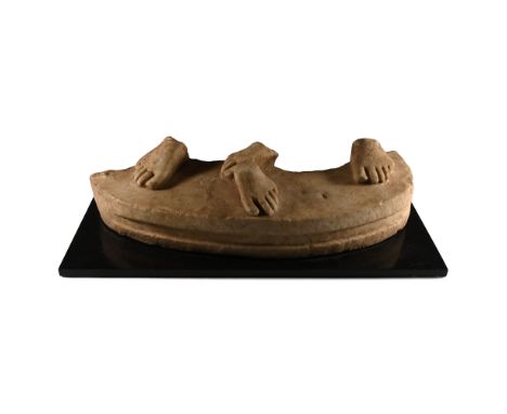1st century A.D. Fragment of an elliptical base for a statuary group, with gusset to the forward edge; upper face with two pa