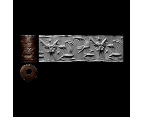 Circa 1500-1250 B.C. Cylinder with cord and bead handles; accompanied by a copy of an old scholarly note, typed by W.G. Lambe