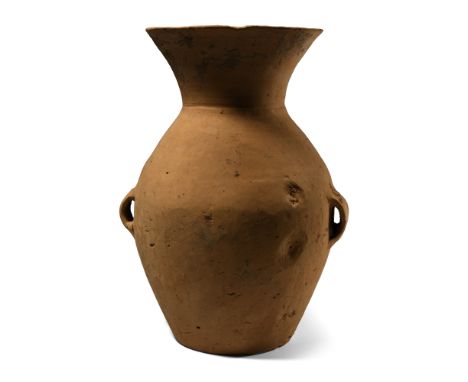 Neolithic Period, 3rd millennium B.C. Biconvex in profile with flared mouth, lateral strap handles at the equator.  1.27 kg, 