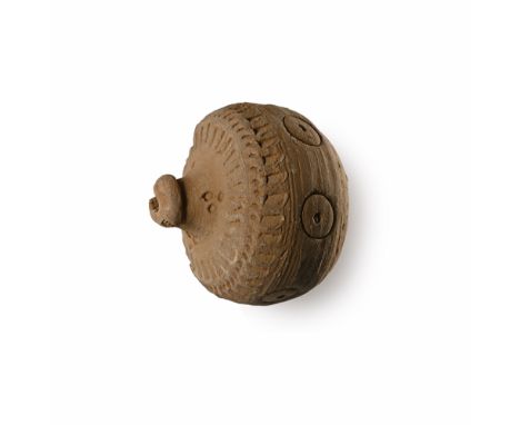 9th-11th century A.D. Squat in profile with domed mouth; ring-and-dot motifs to the body, upper body and shoulder with line d