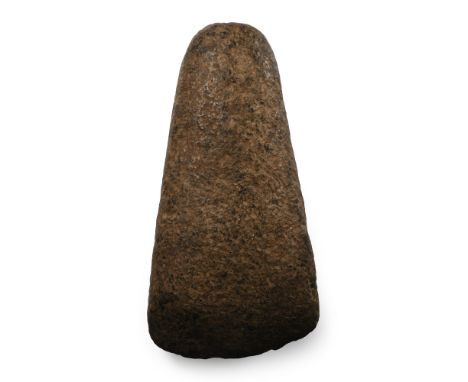 Neolithic Period, 4000-2300 B.P. A complete ground or polished stone axehead sub-ovate in plan, narrower at the butt end with