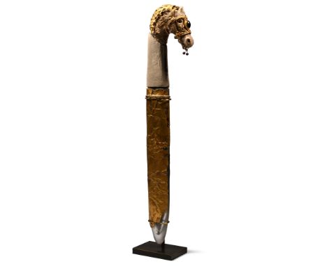 6th-4th century B.C. The upper part of the hilt shaped as a horse-head with an applied sheet-gold mane, wearing a gold bridle