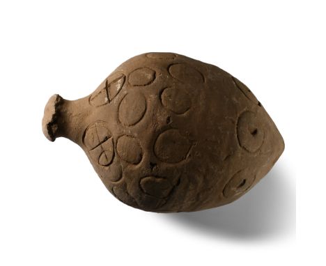 9th-11th century A.D. Piriform in profile with narrow point and domed mouth; the body decorated with impressed annulets and f
