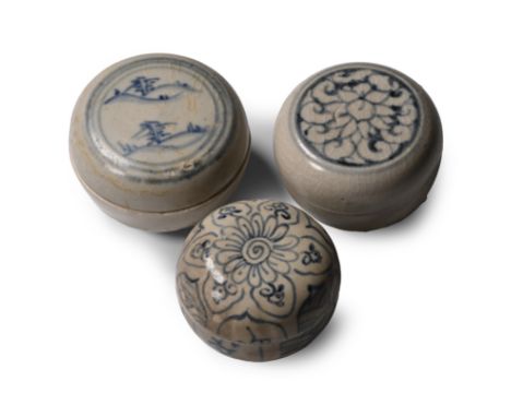 15th century A.D. Comprising three powder boxes, two with painted floral motifs and one with trees in a hilly landscape. Cf. 