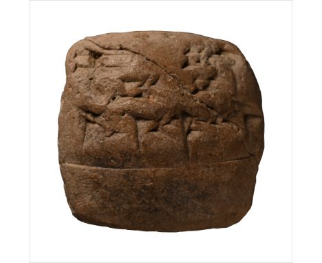Circa 2000-1600 B.C. Pillow-shaped with impressed cuneiform text to both broad faces.  20.9 grams, 35 mm (1 3/8 in.). [No Res