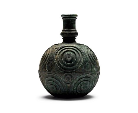 3rd-4th century A.D. Spherical in profile with flat base, large raised concentric circles in two bands with smaller similar m