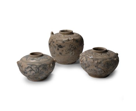 15th century A.D. Comprising three vessels with remains of loop handles above the shoulder, each with painted floral decorati