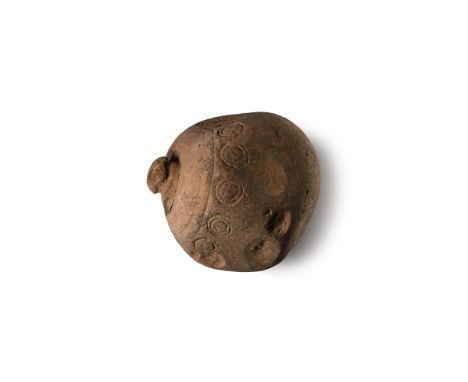 9th-11th century A.D. A large bulbous missile with domed mouth, a circumferential band of annulets to the shoulder, the body 