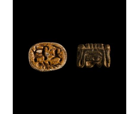 Late Period, 664-332 B.C. Comprising: a scarab with anatomical detailing to the carapace, underside with a crocodile and two 
