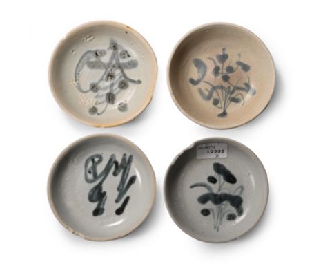 Early 19th century A.D. Comprising four shallow dishes with low foot, painted flower motif to the inner face.  242 grams tota