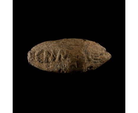 1st century B.C. Biconical lead slingshot (glans) with inscription in Latin letters 'CN' (Cneius) 'MAG' (Magnus) on one side,