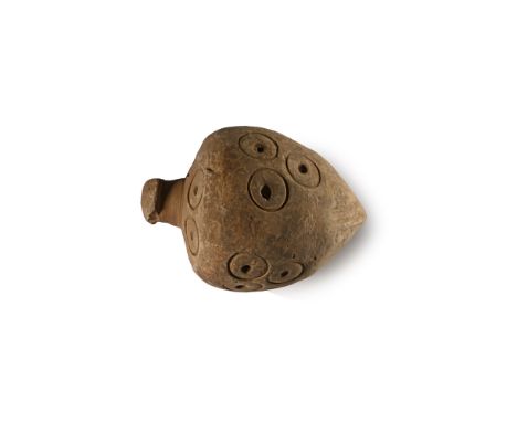 9th-11th century A.D. Piriform in profile with narrow point, deep shoulder and domed mouth; a circumferential band of ring-an