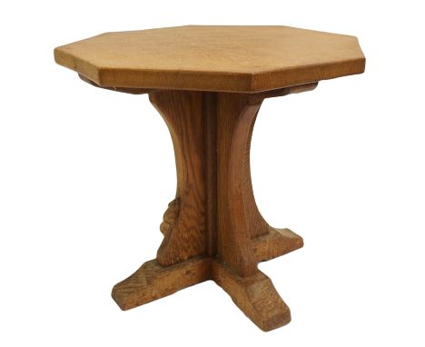 A Robert 'Mouseman' Thompson oak octagonal occasional table with four shaped brackets on square stepped feet, with carved mou