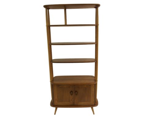 An Ercol room divider the two central shelves being adjustable above cupboard base, 192cm x 92cm x 40cm