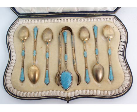 A cased set of Norwegian silver and enamel coffee spoons with tongs the pink enamel with white enamel beading, each spoon 10c