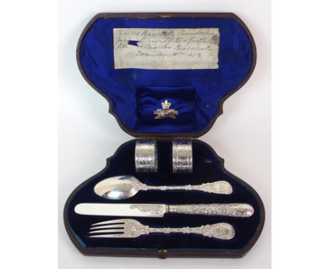 A matched five piece christening set the knife, fork and spoon by Francis Higgins II, London 1871, all with foliate decoratio