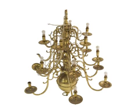 A Dutch style brass three tier chandelier with six scroll branches joined to faux drip-pans mounted on a baluster column, 88c