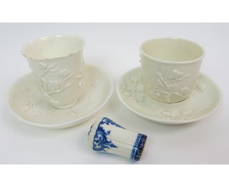 An 18th Century St Cloud blue and white cane handle with underglaze blue scroll motif, the top with flower spray 5.5 cm long,