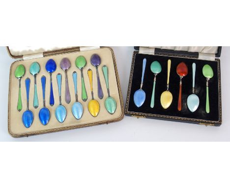 A set of twelve silver and enamel coffee spoons by Adie Bros Limited, Birmingham 1935 in fitted cased with a similar set of s