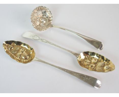 A pair of George III silver berry spoons by Samuel Davenport, London 1792, 22cm long, with a silver sifter ladle by George Wh