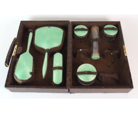 A part (seven piece) silver and green enamel dressing table set by Padgett & Braham Limited, London 1946, comprising; two bru