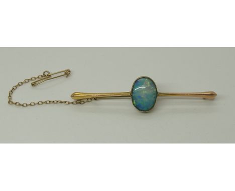 A yellow metal opal bar brooch length 6cm, opal approx 13.7mm x 10mm, weight 3.9gms