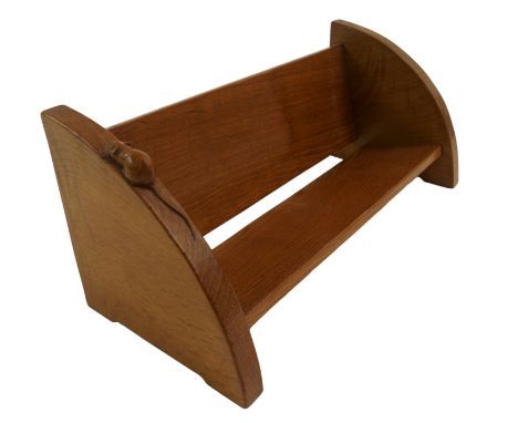 A Robert 'Mouseman' Thompson oak book rack with two angled panels joined by curved ends and with carved mouse signature, 20cm