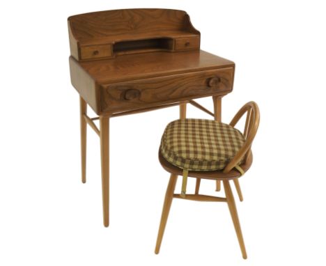 An Ercol writing desk with large single drawer with two smaller drawers and shelf, 98cm x 68cm and a low back spindle chair (