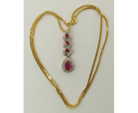 A 14ct gold ruby and diamond pendant and chain length of pendant 3.3cm, chain 46cm, weight 5.6gms