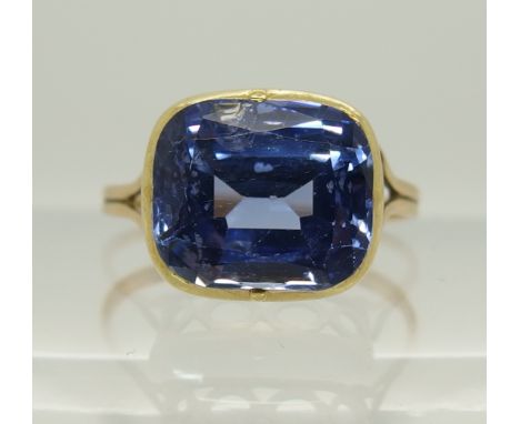 A cushion cut sapphire ring in yellow metal galleried mount, finger size Approx N to O. weight 2.6gms