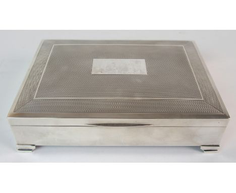 A silver cigarette box maker's marks H. Bros., Birmingham 1973, of rectangular form with engine turned decoration and blank c