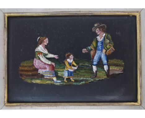 A Pietra Dura plaque of rectangular form depicting a man, woman and child, 7.5cm x 11.5cm, in gilt frame