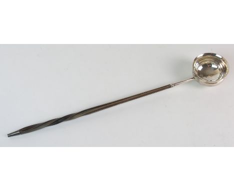 A silver bowled toddy ladle unclear maker's marks and hallmarks with whalebone handle, 36.5cm long