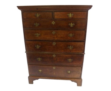 A Georgian oak chest the moulded overhanging cornice above two short and five long graduating drawers on bracket feet, 145cm 