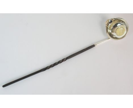 A silver coin set toddy ladle unknown maker, probably London circa 1711 with barley twist whale bone handle, 35cm long