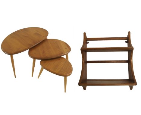 An Ercol nest of three pebble tables the largest 40cm x 65cm x 44cm and an Ercol small two-tier wall hanging rack, 54cm x 43c