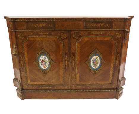 A French kingwood, rosewood, gilt metal mounted credenza with cabouchon band above a foliate freeze and floral roundels above