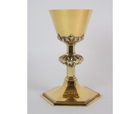 A silver gilt chalice by Hayes &amp; Finch Limited, Birmingham 1964, the inverted conical bowl with embossed decoration, the 