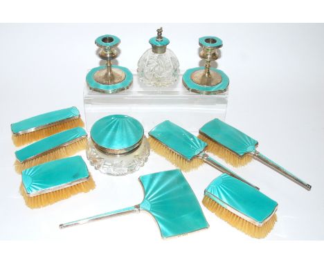 A twelve piece silver and enamel dressing table set by Davis, Moss & Company, Birmingham 1931, comprising; three pairs of bru