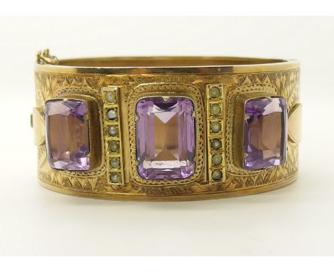 A yellow metal bangle set with amethysts and pearls inner diameter 5.6cm x 4.8cm, width 2.7cm, weight 36.5gms