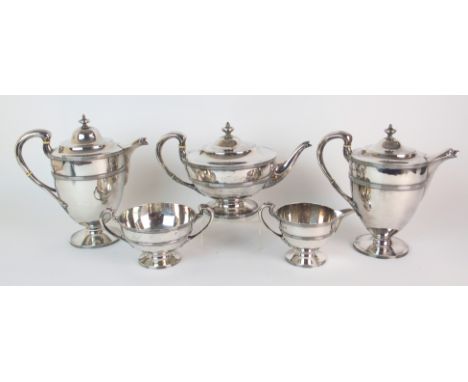 A matched five piece silver tea service the teapot, hot water pot, cream and sugar by Robert Scott, Glasgow 1913, the matched