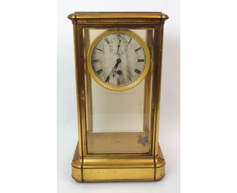A 19th Century four glass gilded mantle clock the silvered dial with Roman numerals and subsidiary dial, the dial and movemen