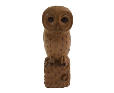 A Robert 'Mouseman' Thompson oak owl naturistically carved and perched on an adzed block base with signature carved mouse, 32