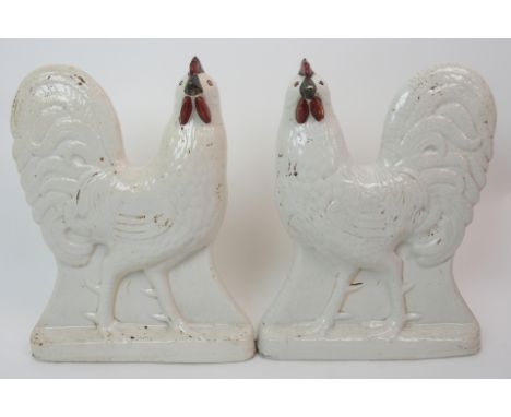 A pair of late 19th/early 20th Century Staffordshire Cockerels with red wattle and comb and gilt highlights, 30.5cm high (2)